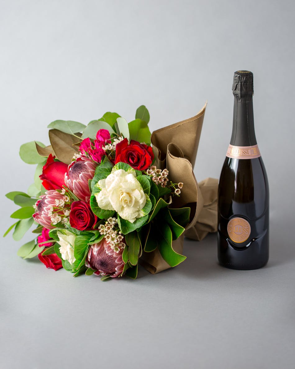 Wrapped Flowers and Wine In Bloom Florist Orlando, FL Heathrow, FL