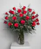 Variations of a medium stem red roses in a glass vase.