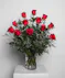 Variations of a medium stem red roses in a glass vase.