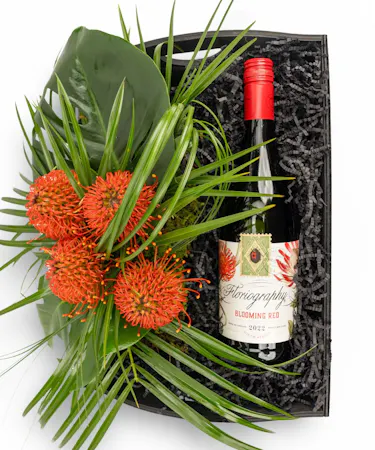 Your choice of wine, a variety of cocktail mixers, a pair of Sugarfina candy and chocolates, and a wine opener set.