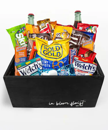 Your choice of wine, a variety of cocktail mixers, a pair of Sugarfina candy and chocolates, and a wine opener set.