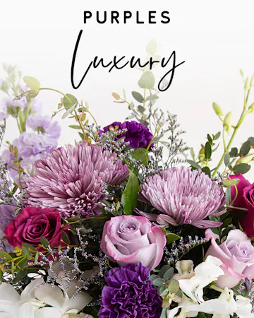 Our expert designers will hand pick fresh floral in purple hues to create a one-of-a-kind custom arrangement. 