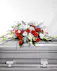 The Noble Patriot Casket Spray is a beautiful way to pay tribute to a loved one. This arrangement sends a message of strength, respect, and freedom with draping fresh flowers.