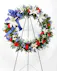 A stunning display of patriotism, strength, and sympathy. This red, white, and blue fresh floral wreath delivers a lovely message about the dignity of the deceased.