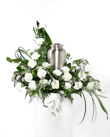  This Devotion Cremation Arrangement is a dignified and loving way to cherish and honor the departed and is the perfect arrangement to surround your loved one's ashes with.