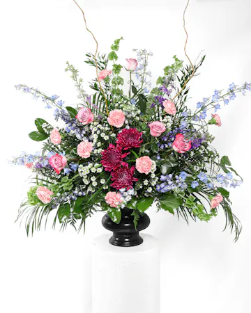 This beautiful mix of pastel flowers and greenery is a lovely reminder of your affection and respect for the dearly departed.