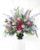 This beautiful mix of pastel flowers and greenery is a lovely reminder of your affection and respect for the dearly departed.