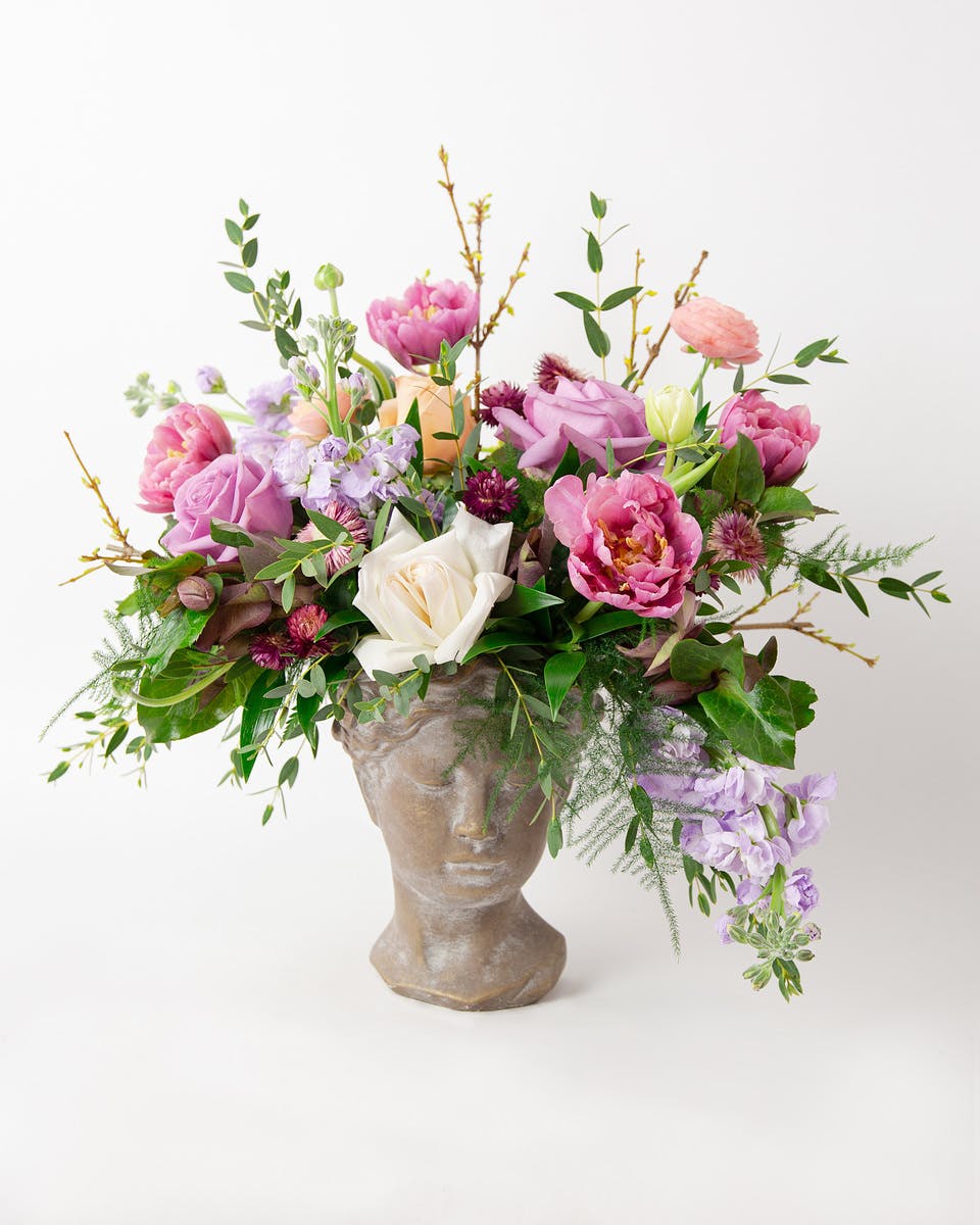 Flowers in Lady Head Planter In Bloom Florist Orlando, FL SameDay Delivery