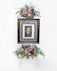 Show tribute to a loved one with an array of pink, light blue, and purple flowers surrounding a picture frame at your loved ones funeral service.
