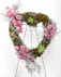 A wonderful array of pink flowers, succulents, and greenery is a lovely way to pay tribute to someone who will always be with you in your heart.