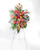 Tropical florals are balanced with lush greenery to offer hope and encourage reflection. The Sunset Solace Standing Spray is vivid and expresses a deep and generous tribute.