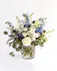 The Heavenly Arrangement is a breathtakingly beautiful arrangement that exudes a sense of peace and tranquility with blue and white florals.