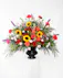 A stylish tribute of brilliant flowers ideal for the funeral home, service, or home. 