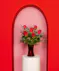 Variations of a medium stem red roses in a glass vase.