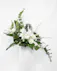 This asymmetrical arrangement features white blooms and elegant greenery will be the perfect addition to add a sense of peace to the urn.