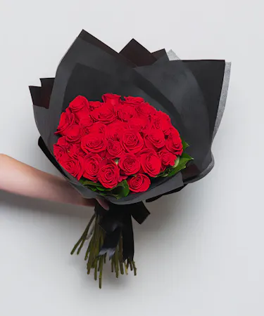 3 Dozen long stem wrapped rose bouquet tied with a ribbon