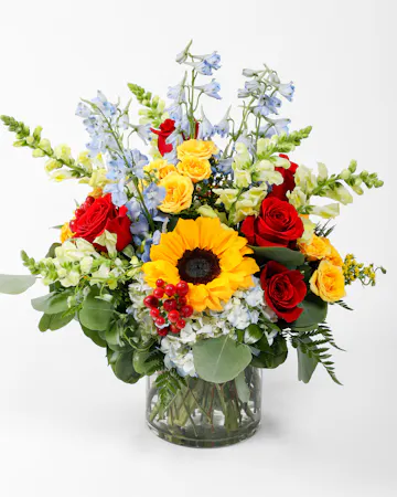 Vibrant and captivating, the Colorful Love arrangement bursts with colors and is a beautiful way to show your love to a friend, family member, or loved one.