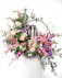 Express your deepest love with shades of pinks and purples. This cremation arrangement is a beautiful way to surround your loved ones urn.