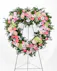 The Graceful Condolence Open Heart is bursting with love and comfort with a mix of pink florals and greenery in the shape of a heart. 