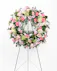 The Graceful Condolence Wreath is a warm and blushing display of peace and beauty, set to honor the deceased. Send your heartfelt emotions with this array of pink florals.