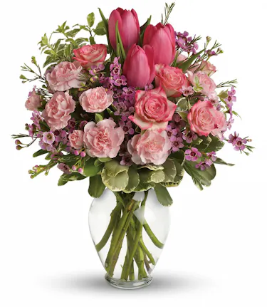 pink flower arrangement with roses, tulips, and carnations