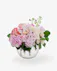 Beautiful cybidium orchids, roses, stock, hydrangea and more are elegantly designed in a clear glass bubble bowl vase