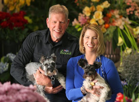 In Bloom's founders, John and Sally, with furry friends